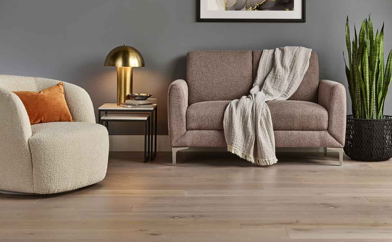 light white oak hardwood in living room with modern round chair and gold table lamp